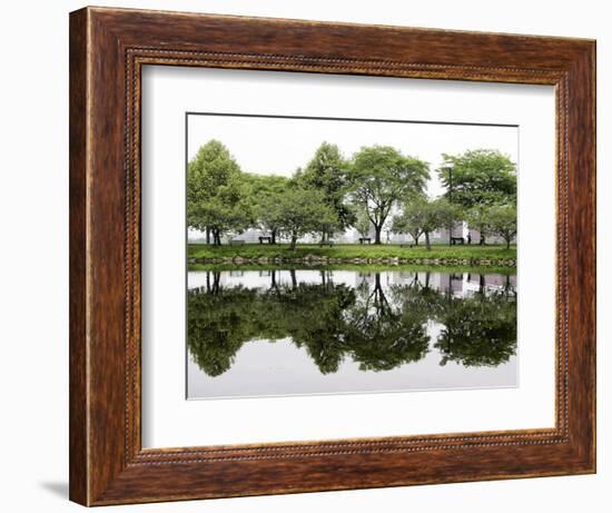 Trees are Reflected in Still Water on the Esplanade Along the Charles River in Boston-null-Framed Photographic Print