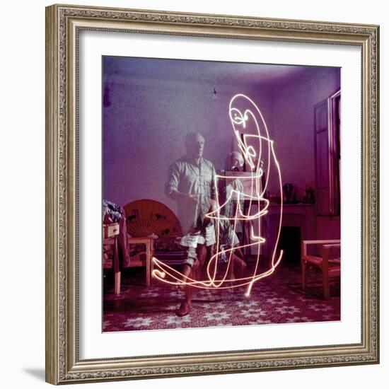 Triple Exposure of Artist Pablo Picasso Drawing with Light at His Home in Vallauris-Gjon Mili-Framed Premium Photographic Print