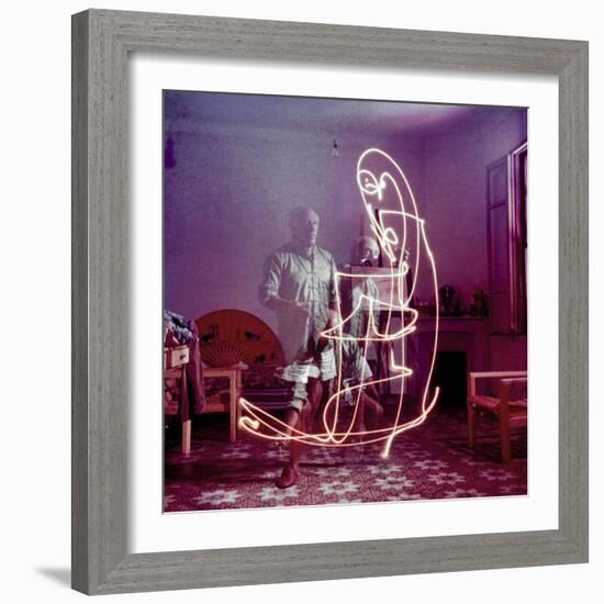 Triple Exposure of Artist Pablo Picasso Drawing with Light at His Home in Vallauris-Gjon Mili-Framed Premium Photographic Print