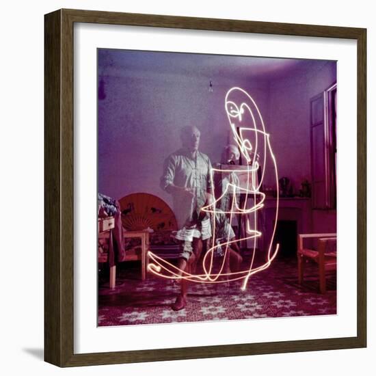 Triple Exposure of Artist Pablo Picasso Drawing with Light at His Home in Vallauris-Gjon Mili-Framed Premium Photographic Print