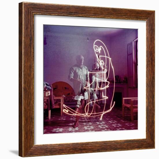 Triple Exposure of Artist Pablo Picasso Drawing with Light at His Home in Vallauris-Gjon Mili-Framed Premium Photographic Print