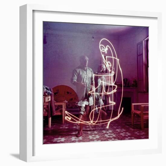 Triple Exposure of Artist Pablo Picasso Drawing with Light at His Home in Vallauris-Gjon Mili-Framed Premium Photographic Print