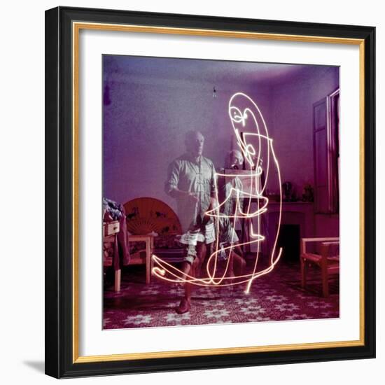 Triple Exposure of Artist Pablo Picasso Drawing with Light at His Home in Vallauris-Gjon Mili-Framed Premium Photographic Print