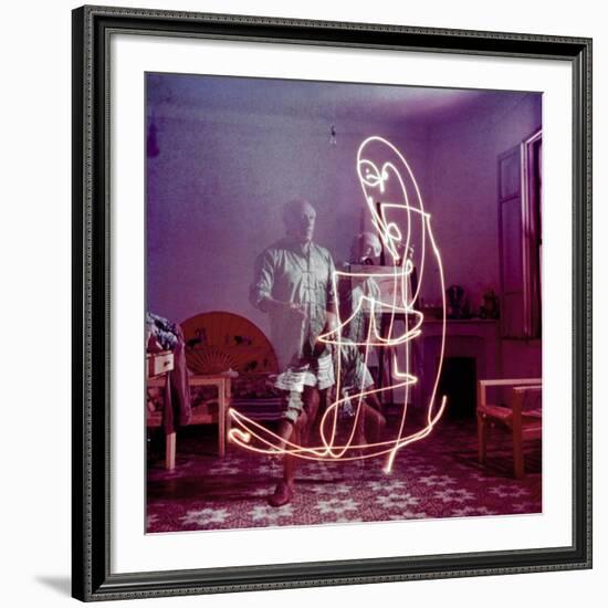 Triple Exposure of Artist Pablo Picasso Drawing with Light at His Home in Vallauris-Gjon Mili-Framed Premium Photographic Print