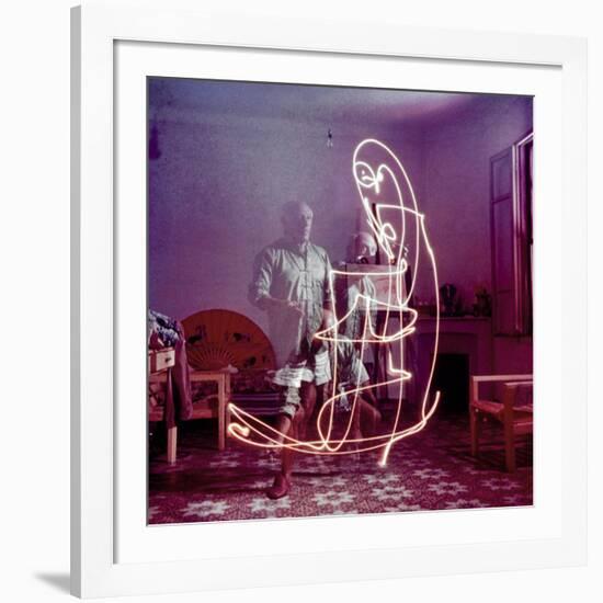 Triple Exposure of Artist Pablo Picasso Drawing with Light at His Home in Vallauris-Gjon Mili-Framed Premium Photographic Print