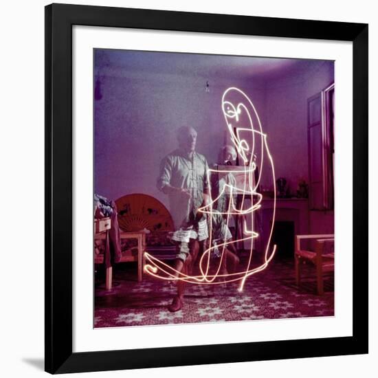 Triple Exposure of Artist Pablo Picasso Drawing with Light at His Home in Vallauris-Gjon Mili-Framed Premium Photographic Print