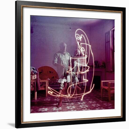 Triple Exposure of Artist Pablo Picasso Drawing with Light at His Home in Vallauris-Gjon Mili-Framed Premium Photographic Print