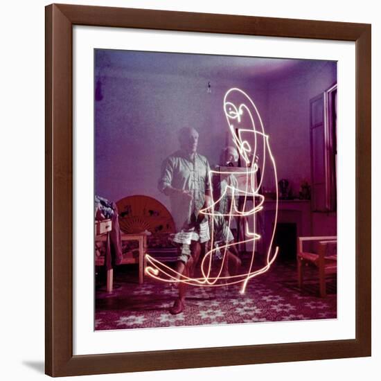 Triple Exposure of Artist Pablo Picasso Drawing with Light at His Home in Vallauris-Gjon Mili-Framed Premium Photographic Print