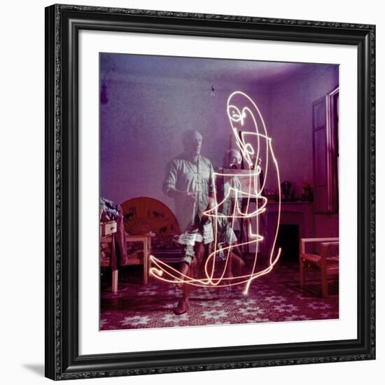 Triple Exposure of Artist Pablo Picasso Drawing with Light at His Home in Vallauris-Gjon Mili-Framed Premium Photographic Print