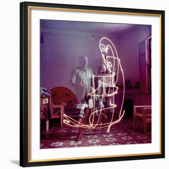 Triple Exposure of Artist Pablo Picasso Drawing with Light at His Home in Vallauris-Gjon Mili-Framed Premium Photographic Print