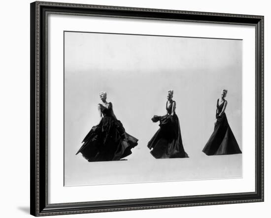 Triple Image of Model Demonstrating Swirling Motion of Black Taffeta Ball Gown Designed by Adrian-Gjon Mili-Framed Photographic Print