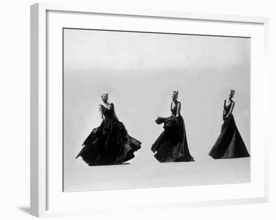 Triple Image of Model Demonstrating Swirling Motion of Black Taffeta Ball Gown Designed by Adrian-Gjon Mili-Framed Photographic Print