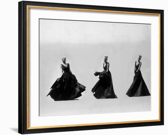 Triple Image of Model Demonstrating Swirling Motion of Black Taffeta Ball Gown Designed by Adrian-Gjon Mili-Framed Photographic Print