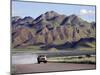 Truck Passing Through the Naukluft Mountains Near Solitaire, Namibia-Julian Love-Mounted Photographic Print