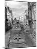 Trucks Driving Through the Ruined Town of Falaise-null-Mounted Photographic Print