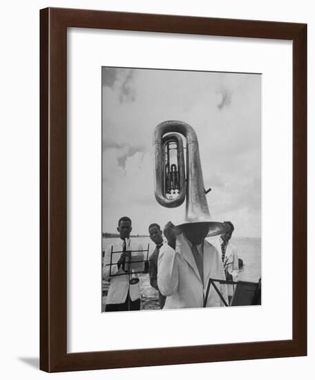 Tuba Player Keeping His Head Dry in a Rainstorm During Visit to St. Croix by Pres. Harry S. Truman-Thomas D^ Mcavoy-Framed Photographic Print