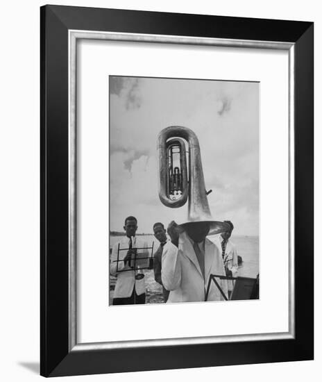 Tuba Player Keeping His Head Dry in a Rainstorm During Visit to St. Croix by Pres. Harry S. Truman-Thomas D^ Mcavoy-Framed Photographic Print