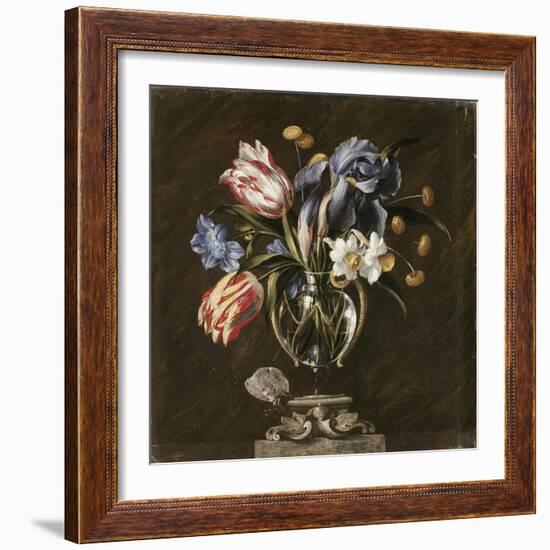 Tulips, Daffodils, Irises and Other Flowers in a Glass Vase on a Sculpted Stand, with a Butterfly-Juan de Arellano-Framed Giclee Print