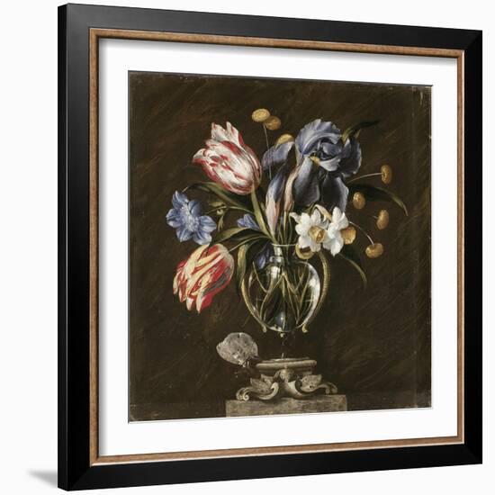 Tulips, Daffodils, Irises and Other Flowers in a Glass Vase on a Sculpted Stand, with a Butterfly-Juan de Arellano-Framed Giclee Print