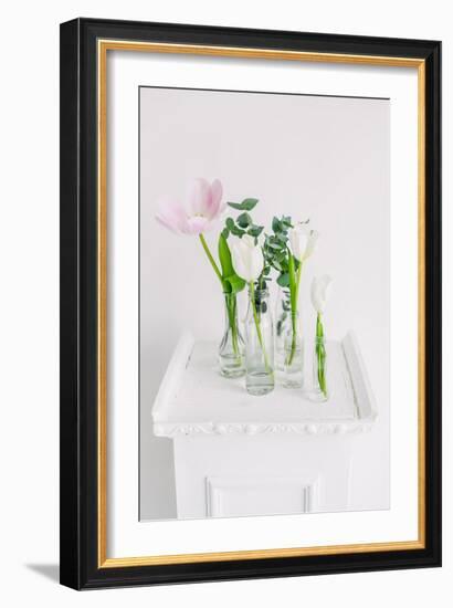 Tulips in Bottles on White Background Studio-Ihor Kopakov-Framed Photographic Print