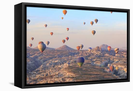 Turkey, Anatolia, Cappadocia, Goreme. Hot air balloons above Red Valley.-Emily Wilson-Framed Premier Image Canvas