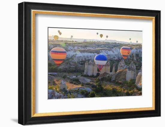 Turkey, Anatolia, Cappadocia, Goreme. Hot air balloons above Red Valley.-Emily Wilson-Framed Photographic Print