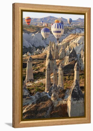 Turkey, Anatolia, Cappadocia, Goreme. Hot air balloons above Red Valley.-Emily Wilson-Framed Premier Image Canvas