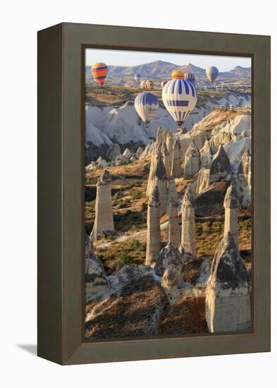 Turkey, Anatolia, Cappadocia, Goreme. Hot air balloons above Red Valley.-Emily Wilson-Framed Premier Image Canvas