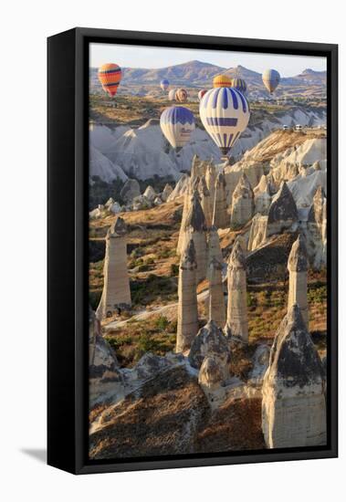 Turkey, Anatolia, Cappadocia, Goreme. Hot air balloons above Red Valley.-Emily Wilson-Framed Premier Image Canvas