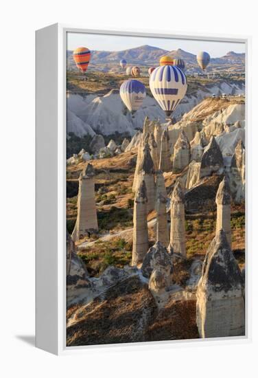 Turkey, Anatolia, Cappadocia, Goreme. Hot air balloons above Red Valley.-Emily Wilson-Framed Premier Image Canvas