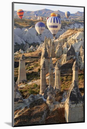 Turkey, Anatolia, Cappadocia, Goreme. Hot air balloons above Red Valley.-Emily Wilson-Mounted Photographic Print