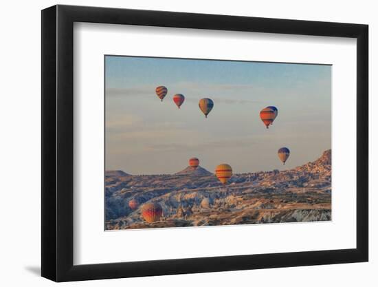 Turkey, Anatolia, Cappadocia, Goreme. Hot air balloons flying above the valley.-Emily Wilson-Framed Photographic Print