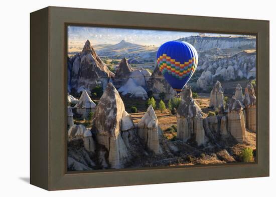 Turkey, Anatolia, Cappadocia, Goreme. Hot air balloons flying above the valley.-Emily Wilson-Framed Premier Image Canvas