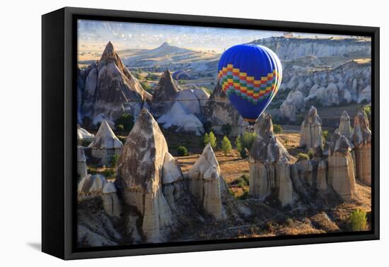 Turkey, Anatolia, Cappadocia, Goreme. Hot air balloons flying above the valley.-Emily Wilson-Framed Premier Image Canvas