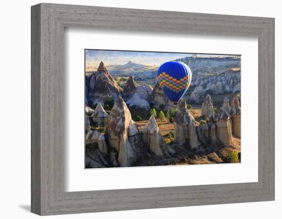 Turkey, Anatolia, Cappadocia, Goreme. Hot air balloons flying above the valley.-Emily Wilson-Framed Photographic Print