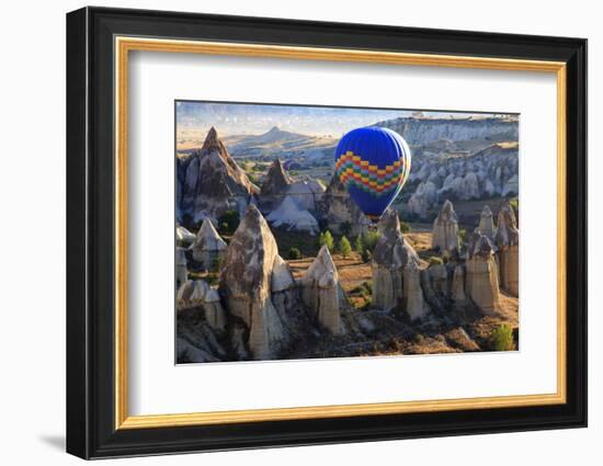 Turkey, Anatolia, Cappadocia, Goreme. Hot air balloons flying above the valley.-Emily Wilson-Framed Photographic Print