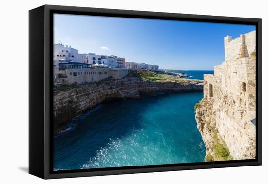 Turquoise sea framed by the old town perched on the rocks, Polignano a Mare, Province of Bari, Apul-Roberto Moiola-Framed Premier Image Canvas