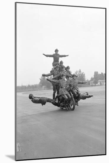 Twelve Policemen Riding One Motorcycle-null-Mounted Photographic Print