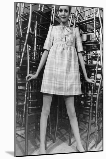 Twiggy Wearing Dolly Dress with Pink Ribbons (By Paul Babb and Pamela Proctor) February 17, 1967-null-Mounted Photo