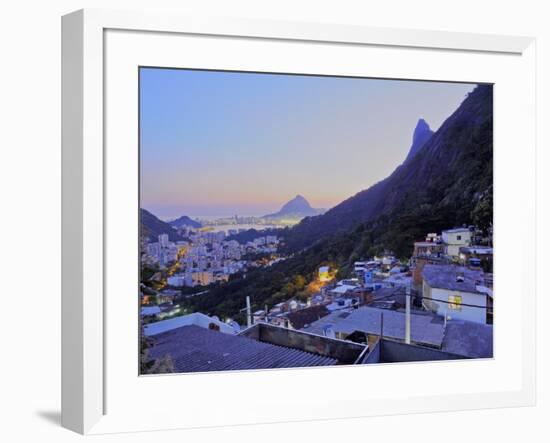 Twilight view of the Favela Santa Marta with Corcovado and the Christ statue behind, Rio de Janeiro-Karol Kozlowski-Framed Photographic Print