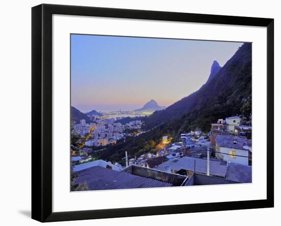 Twilight view of the Favela Santa Marta with Corcovado and the Christ statue behind, Rio de Janeiro-Karol Kozlowski-Framed Photographic Print