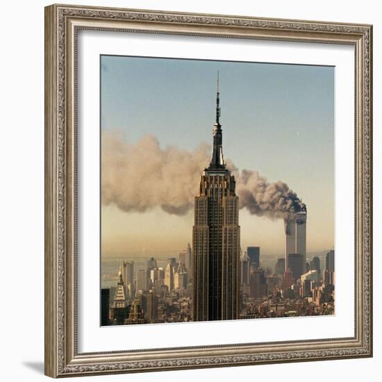 Twin Towers of the World Trade Center Burn Behind the Empire State Buildiing, September 11, 2001-null-Framed Photographic Print