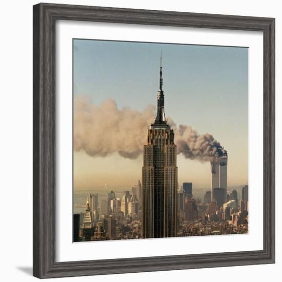 Twin Towers of the World Trade Center Burn Behind the Empire State Buildiing, September 11, 2001-null-Framed Photographic Print