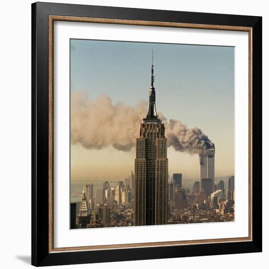 Twin Towers of the World Trade Center Burn Behind the Empire State Buildiing, September 11, 2001-null-Framed Photographic Print