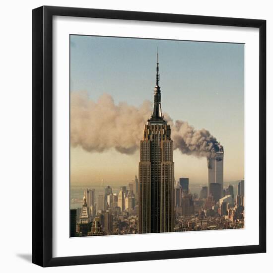 Twin Towers of the World Trade Center Burn Behind the Empire State Buildiing, September 11, 2001-null-Framed Photographic Print