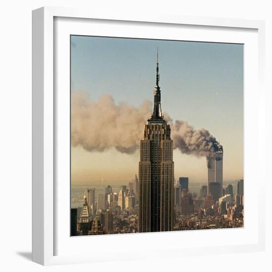 Twin Towers of the World Trade Center Burn Behind the Empire State Buildiing, September 11, 2001-null-Framed Photographic Print