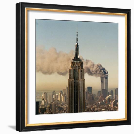 Twin Towers of the World Trade Center Burn Behind the Empire State Buildiing, September 11, 2001-null-Framed Photographic Print