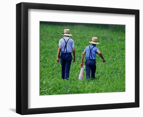 Two Amish Boys Walk with Their Golf Clubs Through a Field of Soy Beans-null-Framed Photographic Print