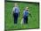 Two Amish Boys Walk with Their Golf Clubs Through a Field of Soy Beans-null-Mounted Photographic Print