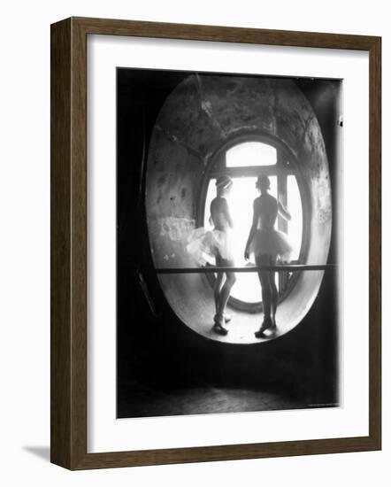 Two Ballerinas Standing in Window of the Paris Opera During Rehearsal of "Swan Lake"-Alfred Eisenstaedt-Framed Photographic Print